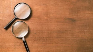 Close-up of a magnifying glass, highlighting careful research for North Atlanta first-time homebuyers