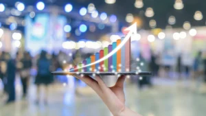 Hand holding bar graph with rising arrow, representing growing Lake Lanier investment and residential demand