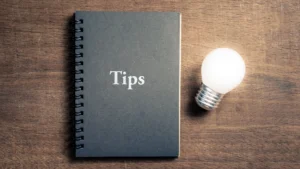 Notebook labeled Tips with a lightbulb, reflecting key seller strategies for 2025 Lake Lanier market