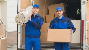 Professional movers carefully transporting boxes and furniture for a North Atlanta house move