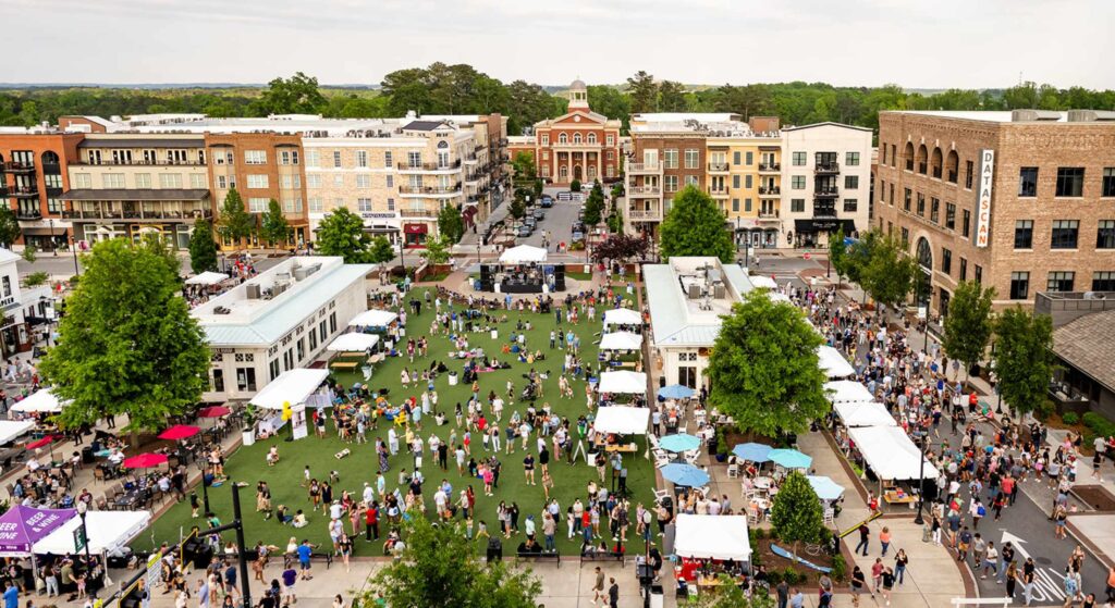 Alpharetta, GA City Center with locals at the market, shops and restaurants.